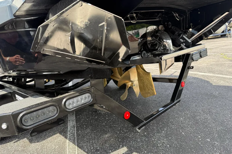 Slide: The Image of 2025 MasterCraft NXT24 boat stern with propeller and LED lights. - 8