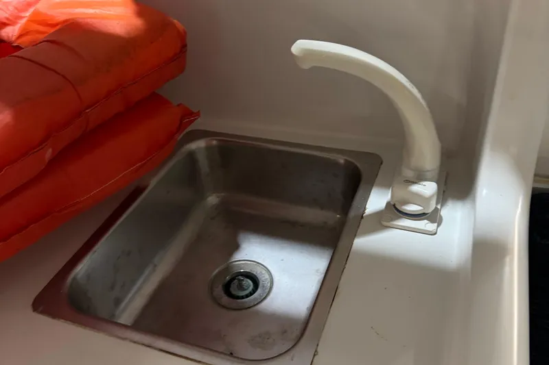 Slide: The Image of Stainless steel sink and faucet in 2001 Adventure Craft 2800 Cabin Yacht. - 12