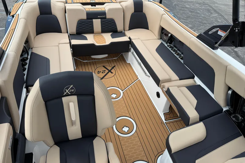 Slide: The Image of 2025 MasterCraft X24 boat interior with luxurious seating and stylish design. - 10