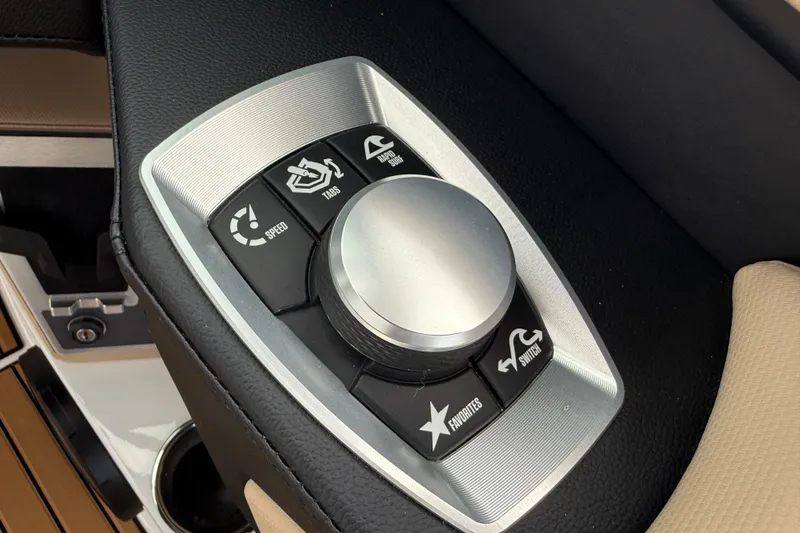 Slide: The Image of Control panel of 2025 MasterCraft X24 boat with various function buttons. - 22