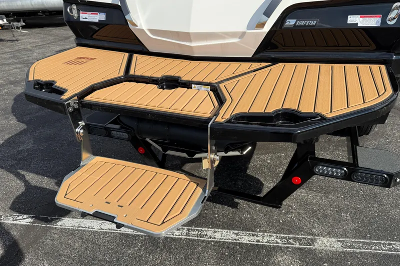 Slide: The Image of 2025 MasterCraft X24 boat with teak swim platform and foldable ladder. - 30