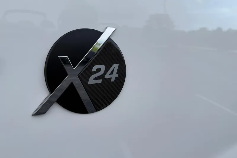 Slide: The Image of 2025 MasterCraft X24 logo on sleek black and silver background. - 34