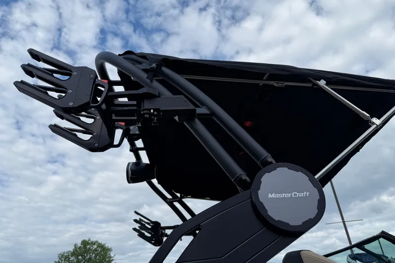 Slide: The Image of 2025 MasterCraft X24 boat tower against a cloudy sky background. - 37