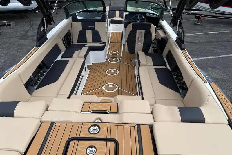 Slide: The Image of 2025 MasterCraft X24 boat interior with luxurious seating and sleek design. - 4
