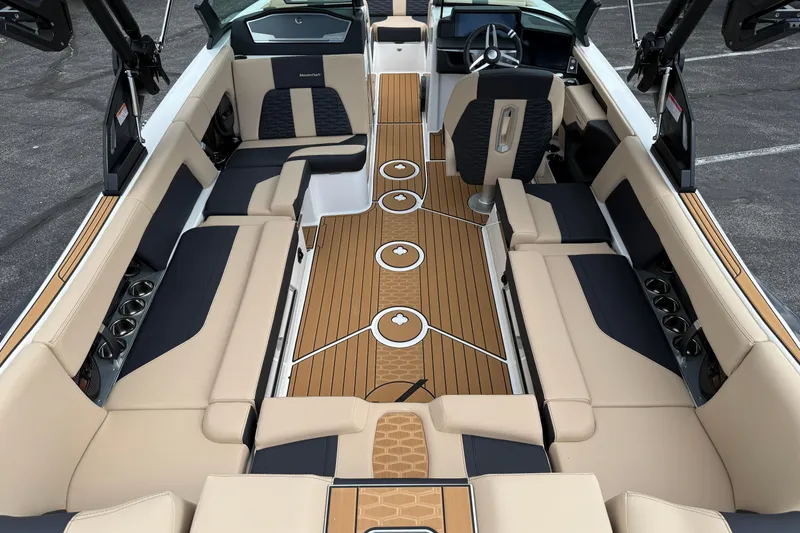 Slide: The Image of 2025 MasterCraft X24 boat interior with luxurious seating and modern design. - 6