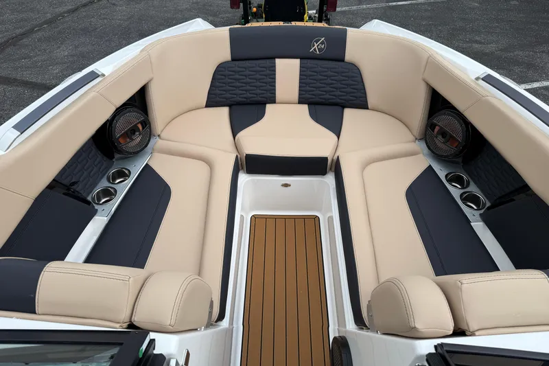 Slide: The Image of Luxurious interior of 2025 MasterCraft X24 boat with beige and black seating. - 7