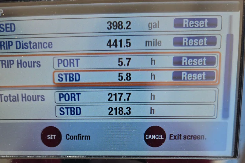 Slide: The Image of Display screen of a 2016 Grady-White Freedom 307 boat showing trip data and engine hours. - 15