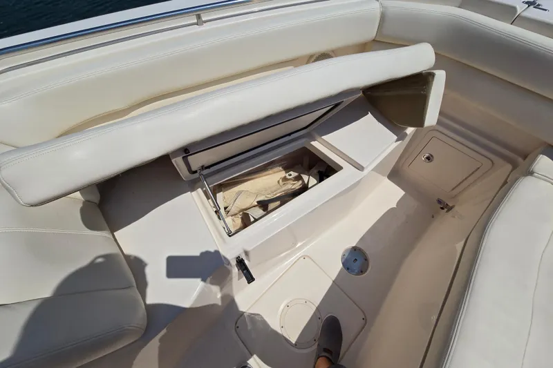 Slide: The Image of 2016 Grady-White Freedom 307 boat interior with open storage compartment. - 19