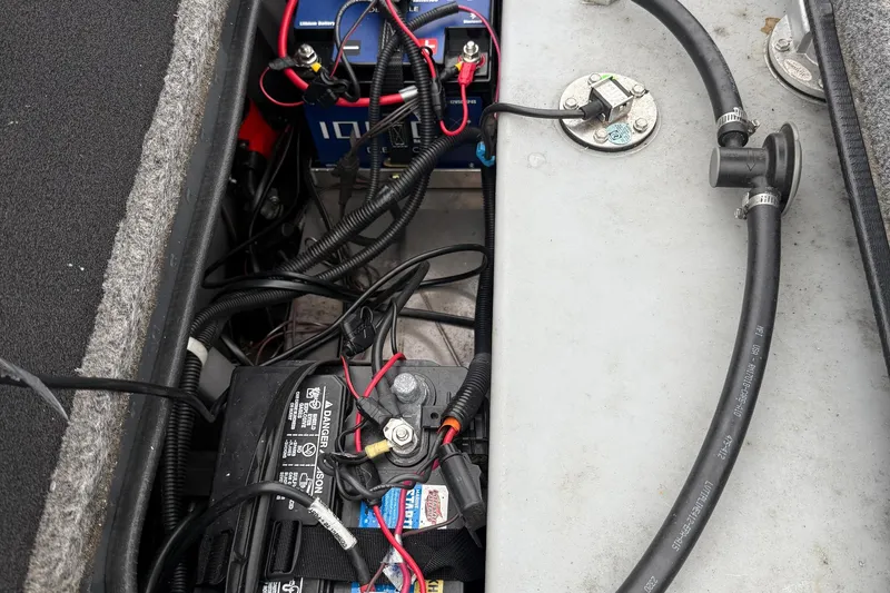 Slide: The Image of 2021 Ranger RT178 boat battery compartment with wiring and connections. - 11