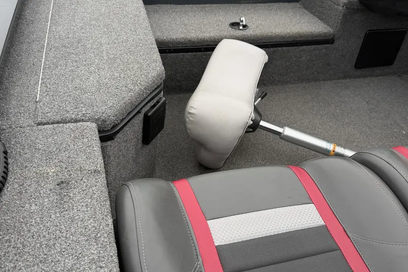 Slide: The Image of 2021 Ranger RT178 boat interior with gray and red seating, carpeted flooring. - 13