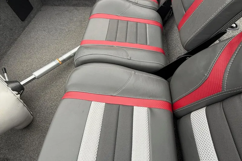 Slide: The Image of 2021 Ranger RT178 boat interior with gray and red seats, featuring a sleek design. - 15