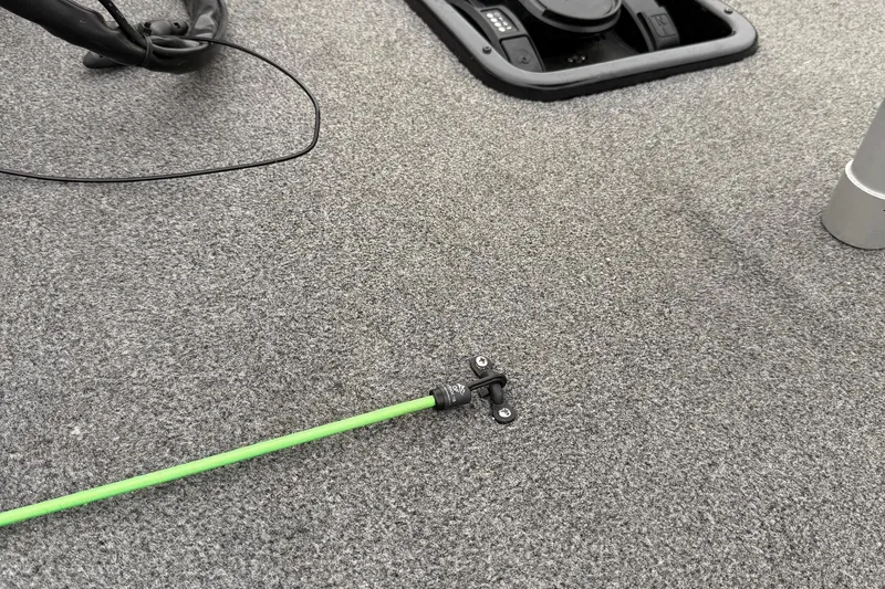 Slide: The Image of 2021 Ranger RT178 boat deck with green fishing rod and equipment. - 16