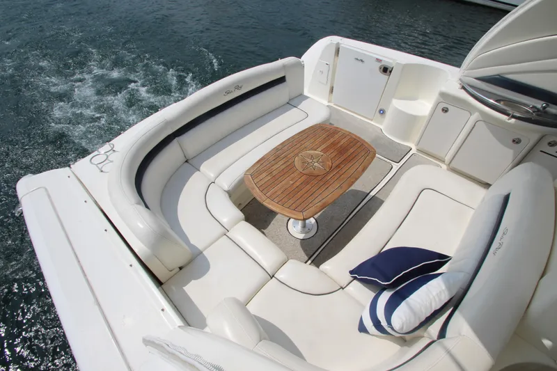 Slide: The Image of Luxurious 2004 Sea Ray 40 Sundancer yacht with elegant seating and wooden table. - 22
