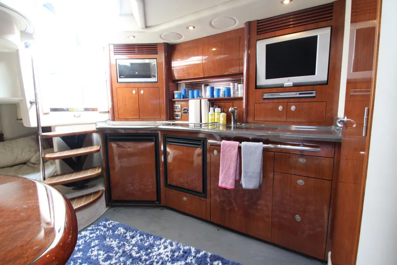 Slide: The Image of Luxurious 2004 Sea Ray 40 Sundancer yacht interior with modern kitchen amenities. - 36