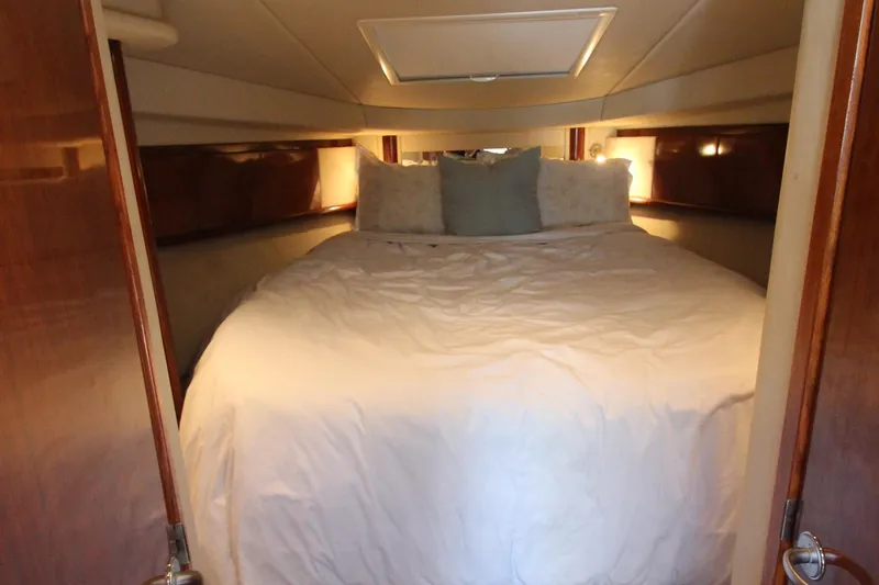Slide: The Image of Luxurious cabin interior of 2004 Sea Ray 40 Sundancer yacht with cozy bedding. - 38