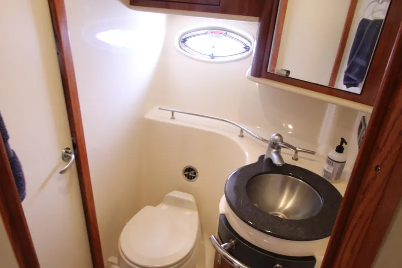 Slide: The Image of Compact bathroom in 2004 Sea Ray 40 Sundancer yacht with sink and toilet. - 39