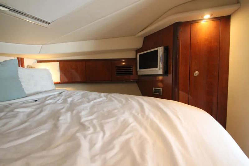 Slide: The Image of Luxurious cabin interior of 2004 Sea Ray 40 Sundancer yacht with cozy bedding. - 44