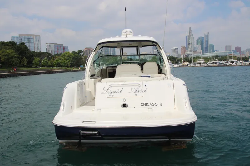 Slide: The Image of 2004 Sea Ray 40 Sundancer yacht on water, Chicago skyline in background. - 6