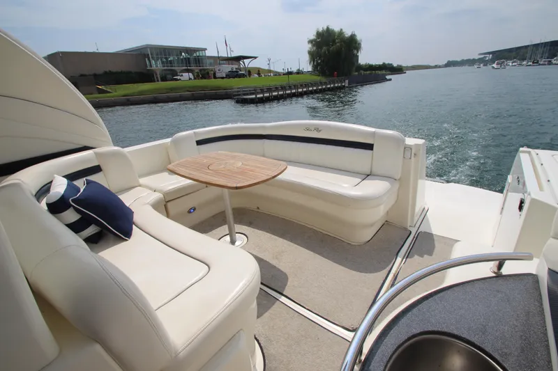 Slide: The Image of 2004 Sea Ray 40 Sundancer yacht with elegant seating and table on deck. - 9