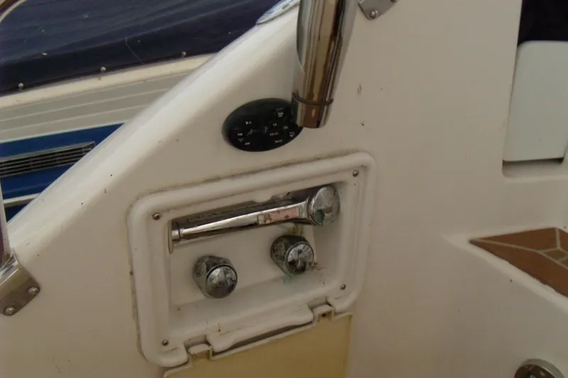 Slide: The Image of Control panel of 2006 Regal Commodore 4460 boat with chrome handles and dials. - 10