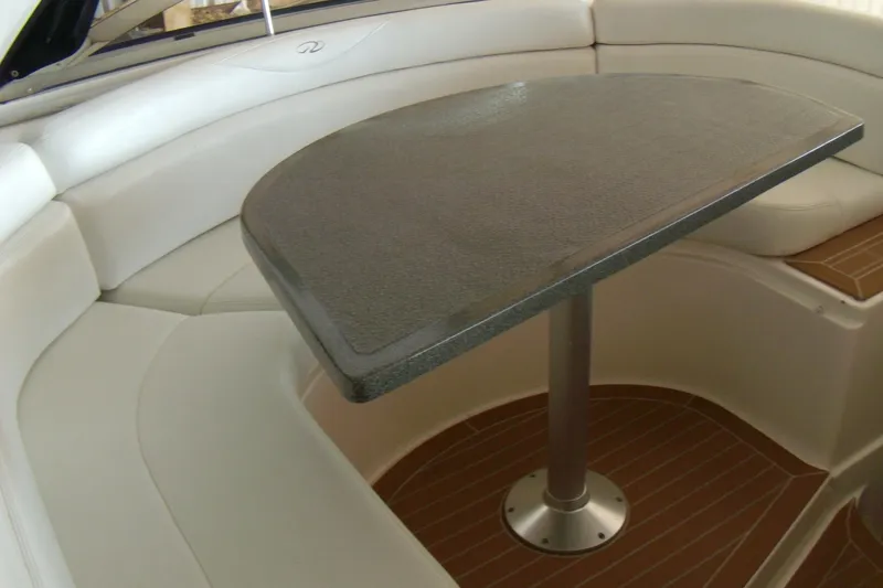 Slide: The Image of 2006 Regal Commodore 4460 interior with elegant seating and sleek table design. - 26