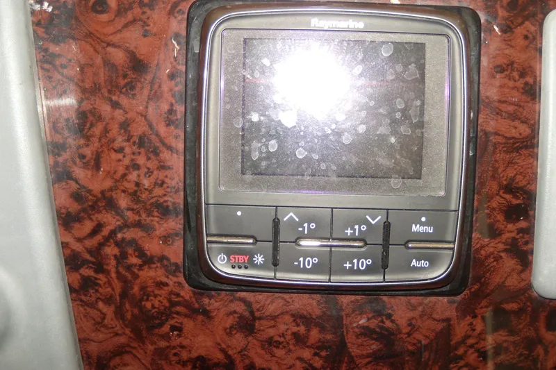 Slide: The Image of Raymarine control panel on 2006 Regal Commodore 4460 boat dashboard. - 30