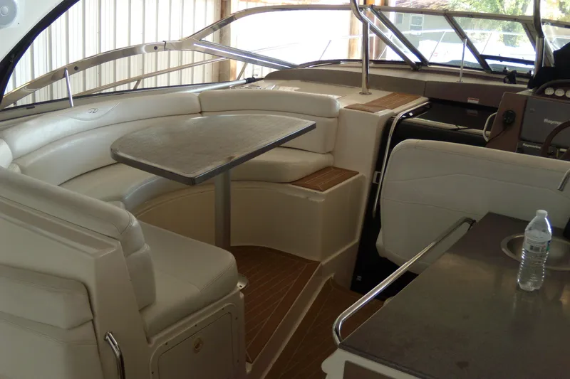 Slide: The Image of 2006 Regal Commodore 4460 yacht interior with seating and table in cabin area. - 36