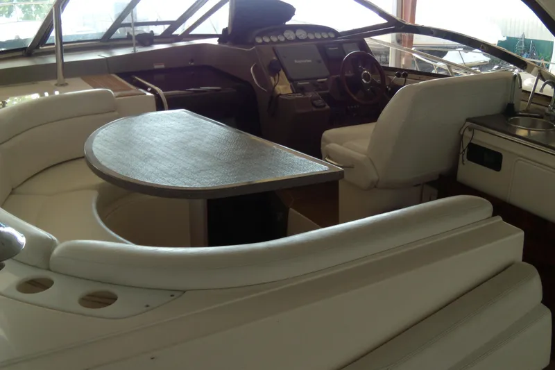 Slide: The Image of Interior of 2006 Regal Commodore 4460 yacht with seating and helm station. - 37