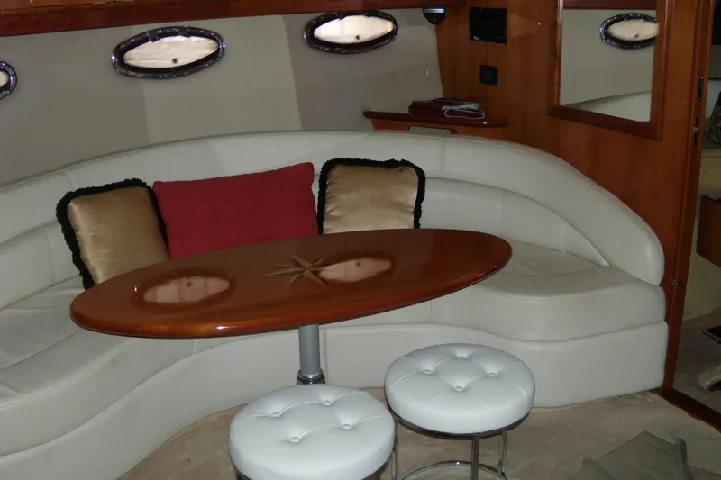 Slide: The Image of Luxurious interior of 2006 Regal Commodore 4460 yacht with plush seating and elegant table. - 42