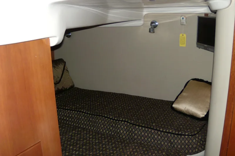 Slide: The Image of 2006 Regal Commodore 4460 cabin interior with bed and TV. - 44