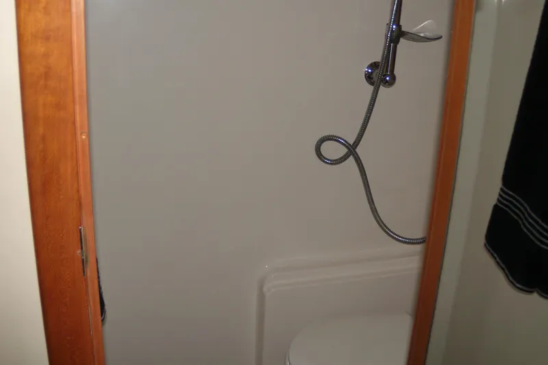 Slide: The Image of Shower area in 2006 Regal Commodore 4460 boat with handheld showerhead. - 46