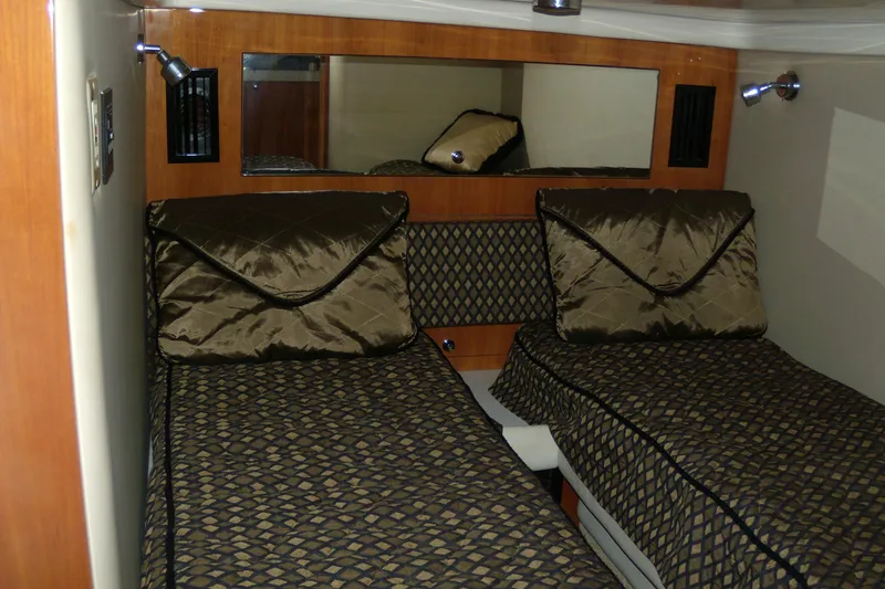 Slide: The Image of 2006 Regal Commodore 4460 cabin with twin beds and elegant bedding. - 47