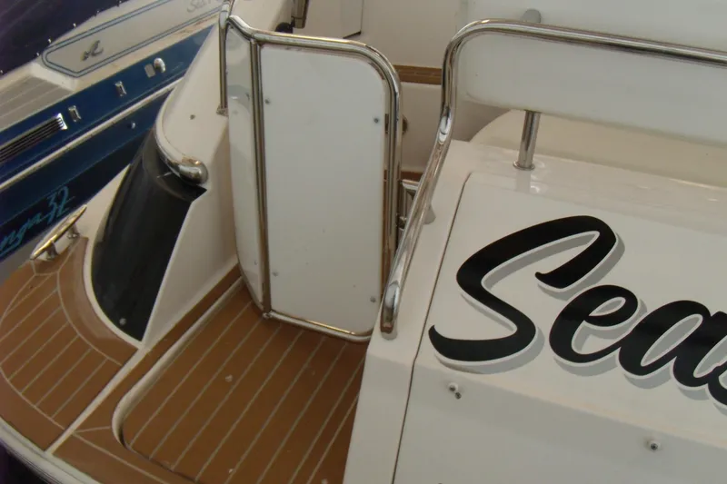Slide: The Image of 2006 Regal Commodore 4460 yacht with teak deck and stainless steel railing. - 5