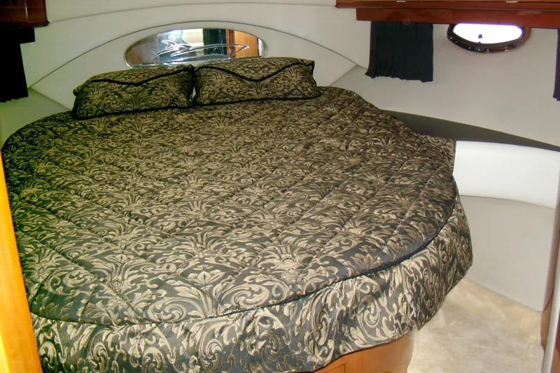 Slide: The Image of Luxurious bedroom interior of 2006 Regal Commodore 4460 yacht with elegant bedding. - 50