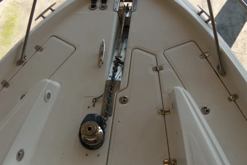 Slide: The Image of 2006 Regal Commodore 4460 boat deck with anchor chain and winch. - 56