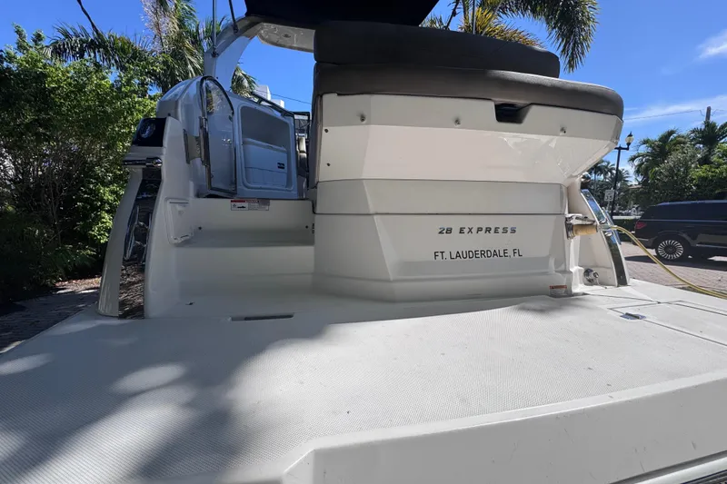 Slide: The Image of 2015 Regal 28 Express boat docked in Fort Lauderdale, Florida, under sunny skies. - 11