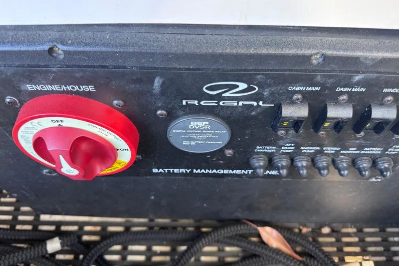 Slide: The Image of 2015 Regal 28 Express battery management panel with switches and controls. - 15