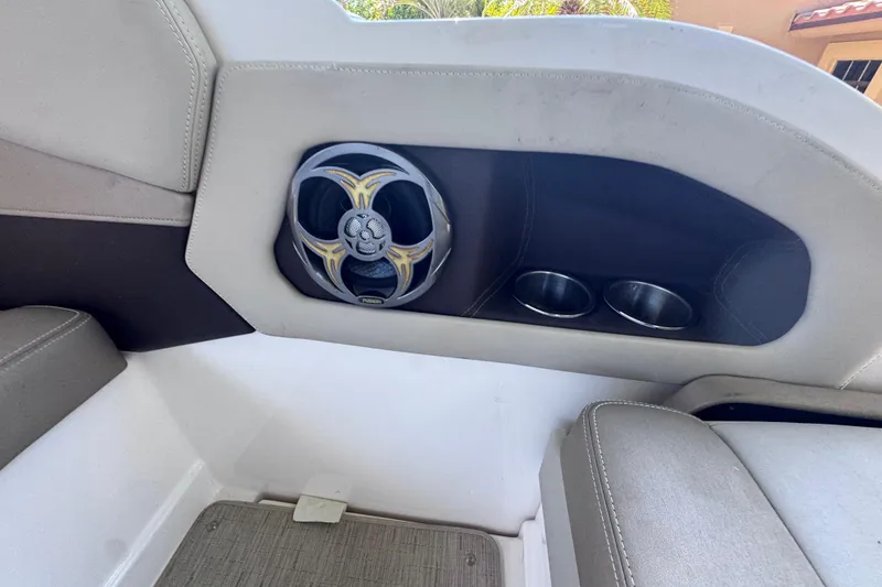 Slide: The Image of Interior of 2015 Regal 28 Express boat with speaker and cup holders. - 21