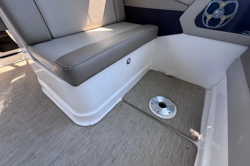 Slide: The Image of 2015 Regal 28 Express boat interior with gray seating and floor detail. - 31