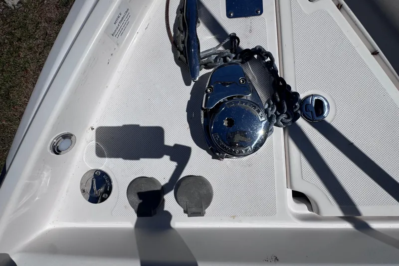 Slide: The Image of 2015 Regal 28 Express boat deck with anchor chain and winch system. - 41