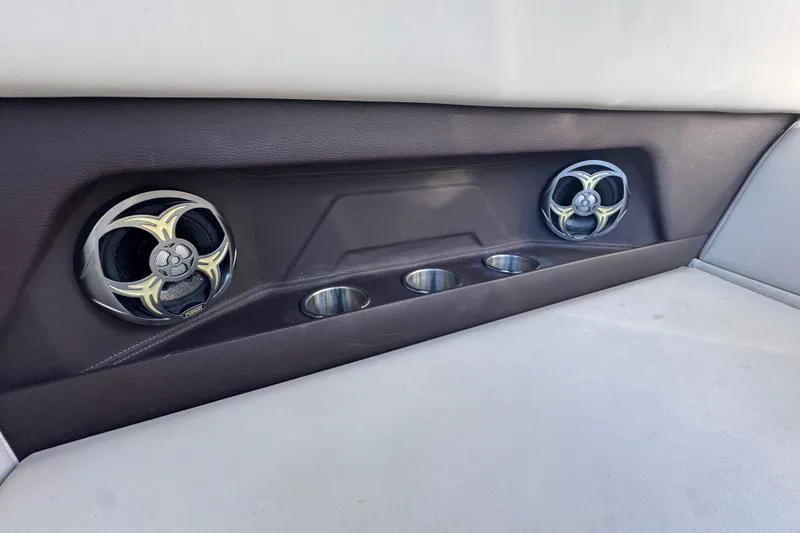 Slide: The Image of Interior of 2015 Regal 28 Express boat with speakers and cup holders. - 60