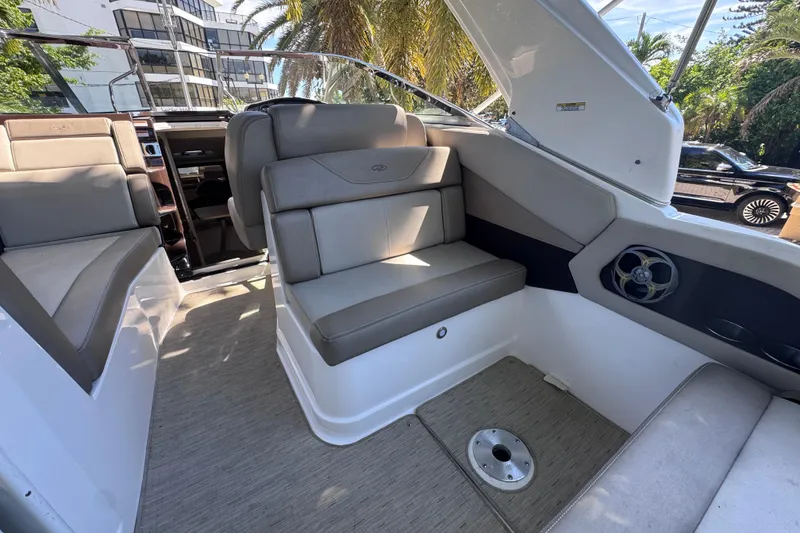 Slide: The Image of Interior of 2015 Regal 28 Express boat with gray seating and modern design. - 63