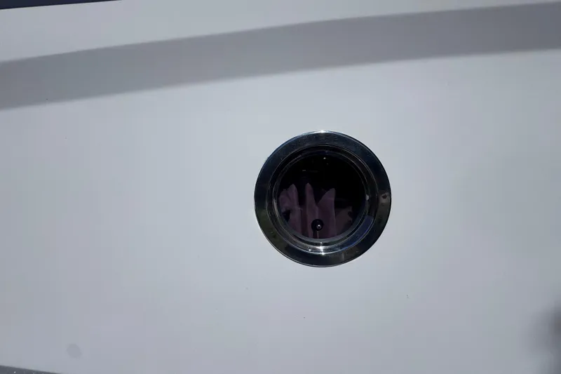 Slide: The Image of Porthole on 2015 Regal 28 Express boat, featuring sleek design and chrome finish. - 68