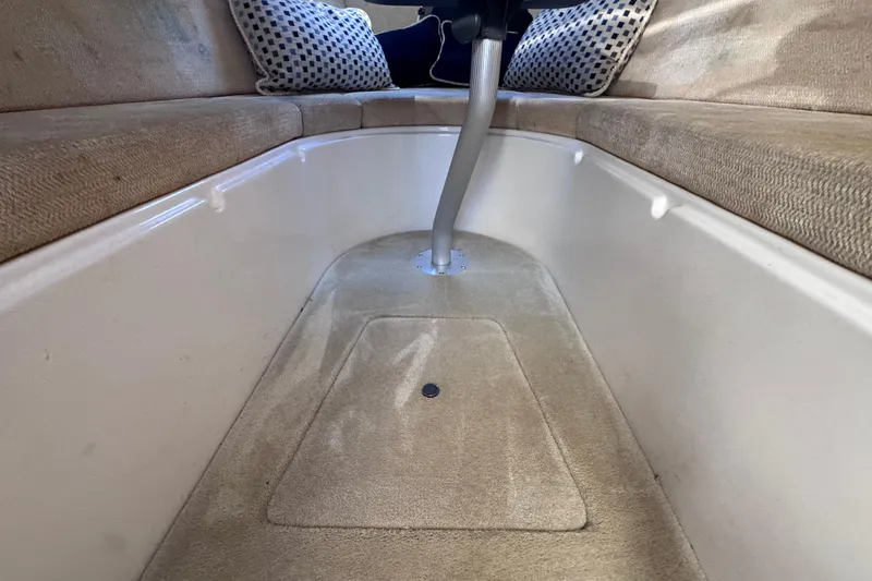 Slide: The Image of Interior cabin of 2015 Regal 28 Express boat with beige seating and cushions. - 71