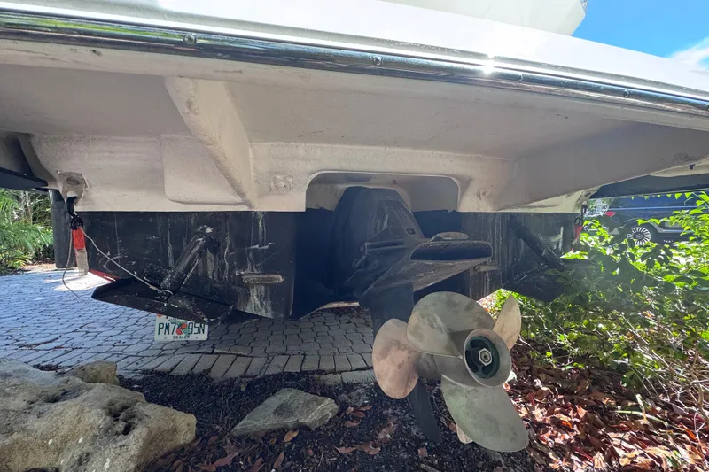 Slide: The Image of 2015 Regal 28 Express boat stern with propeller and license plate visible. - 75