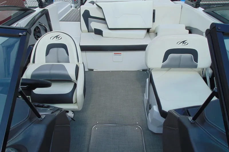Slide: The Image of Interior of a 2015 Monterey 238SS boat with white and gray seating. - 11