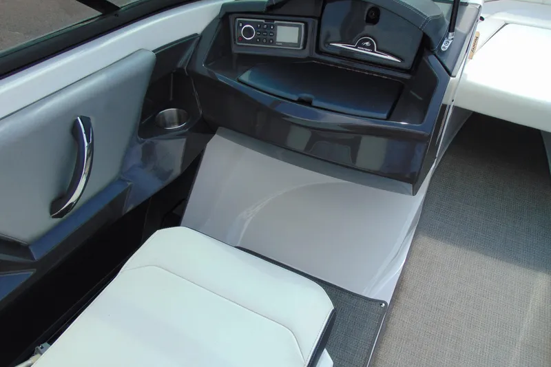 Slide: The Image of Interior of a 2015 Monterey 238SS boat, featuring sleek design and modern controls. - 12