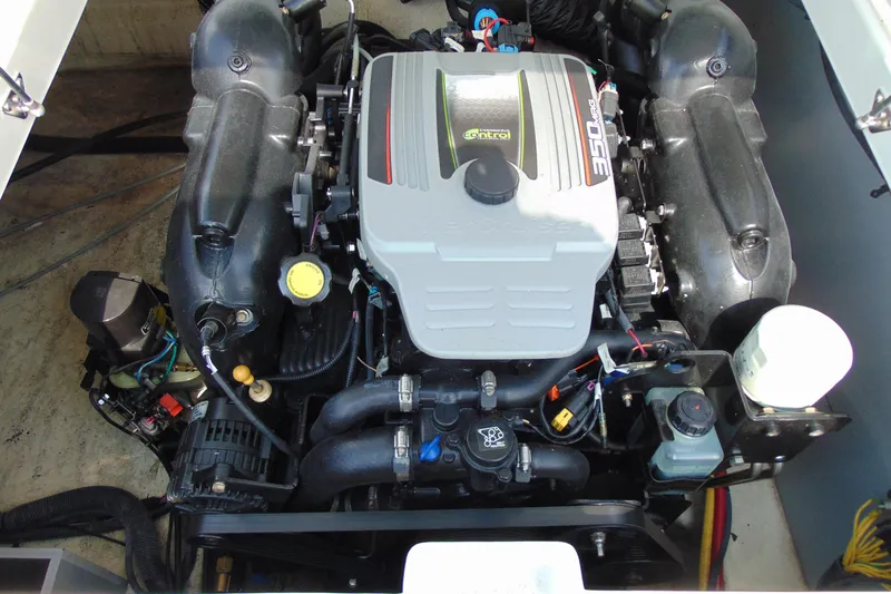 Slide: The Image of Engine of a 2015 Monterey 238SS boat, showcasing detailed components and layout. - 16