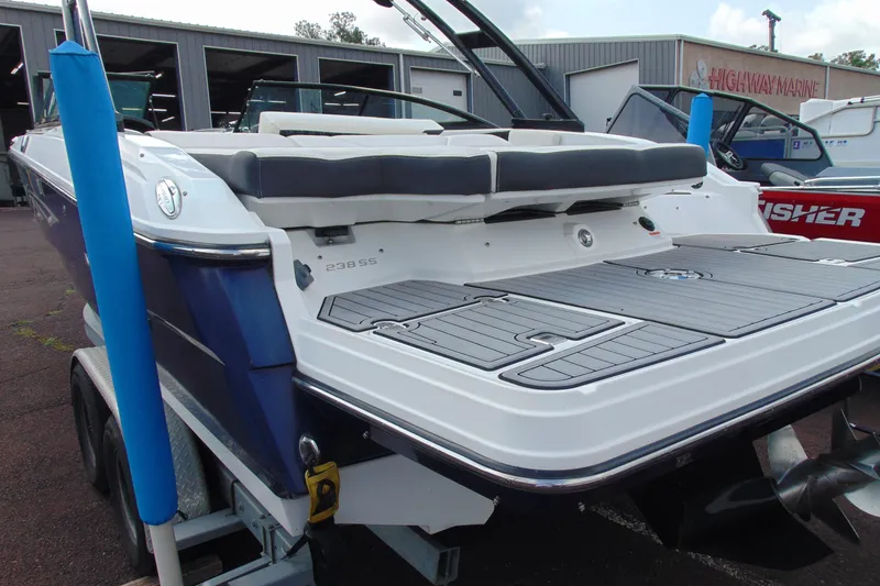 Slide: The Image of 2015 Monterey 238SS boat with sleek design, docked at a marina. - 4