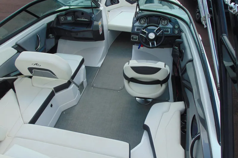 Slide: The Image of 2015 Monterey 238SS boat interior with white seating and modern dashboard. - 9